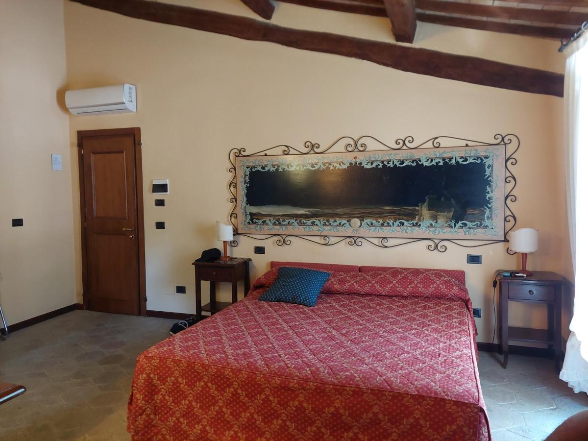 Letto o letti in una camera di Country Hotel Poggiomanente