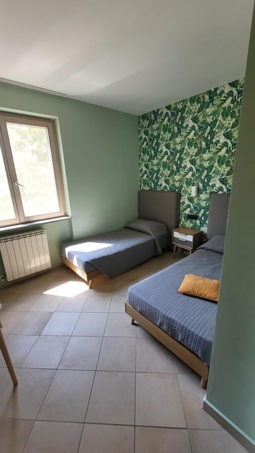 Letto o letti in una camera di Le Colonne