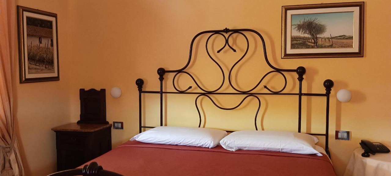 Letto o letti in una camera di Mongalletto