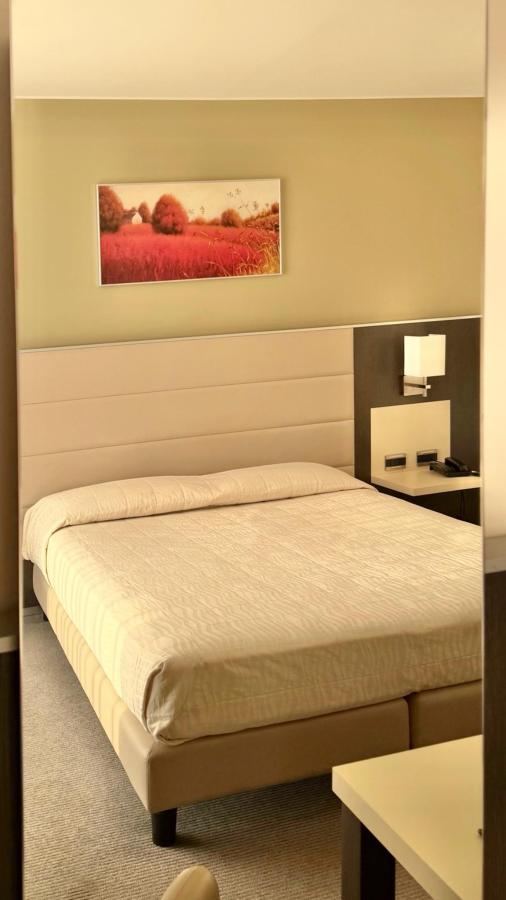 Letto o letti in una camera di Hotel Rivarolo