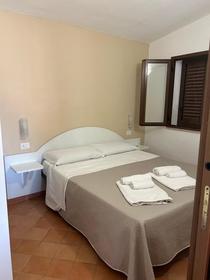 Letto o letti in una camera di Cilento Dreams Village