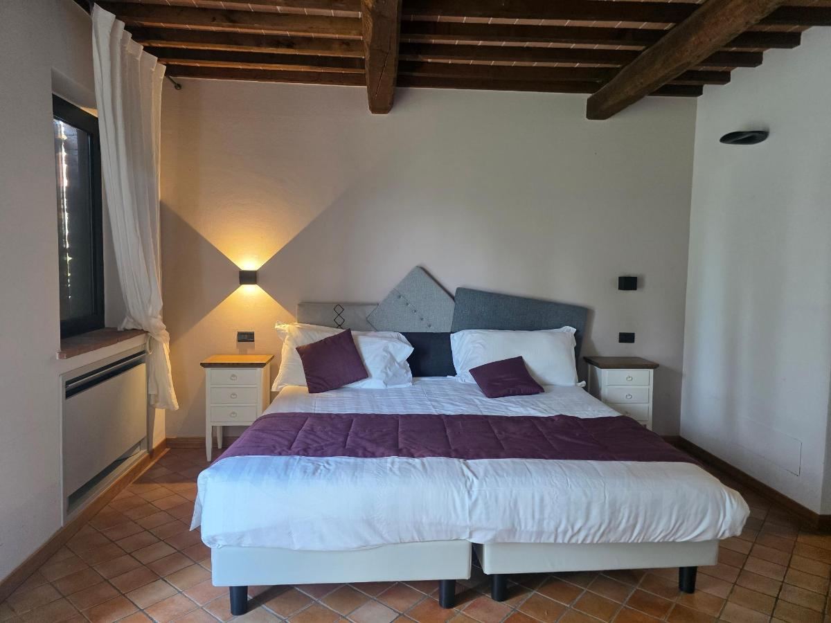 Letto o letti in una camera di Porsenna Resort