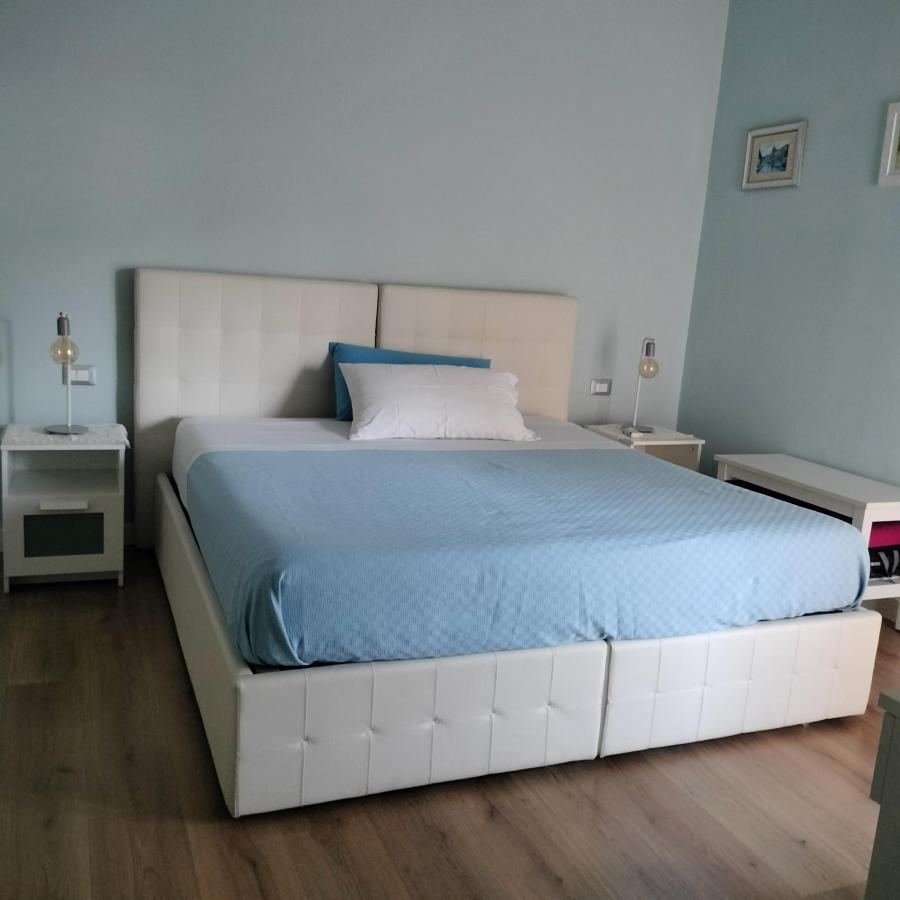 Letto o letti in una camera di Momentoroma b&b