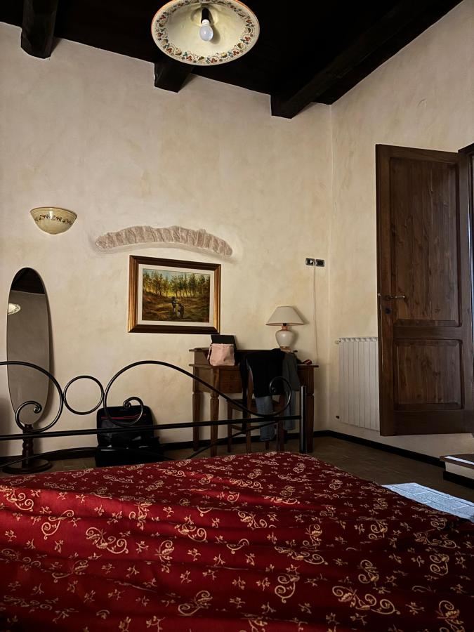 Letto o letti in una camera di Castello di Pupaggi