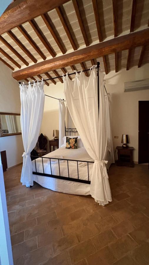 Letto o letti in una camera di Ripa Relais Colle Del Sole