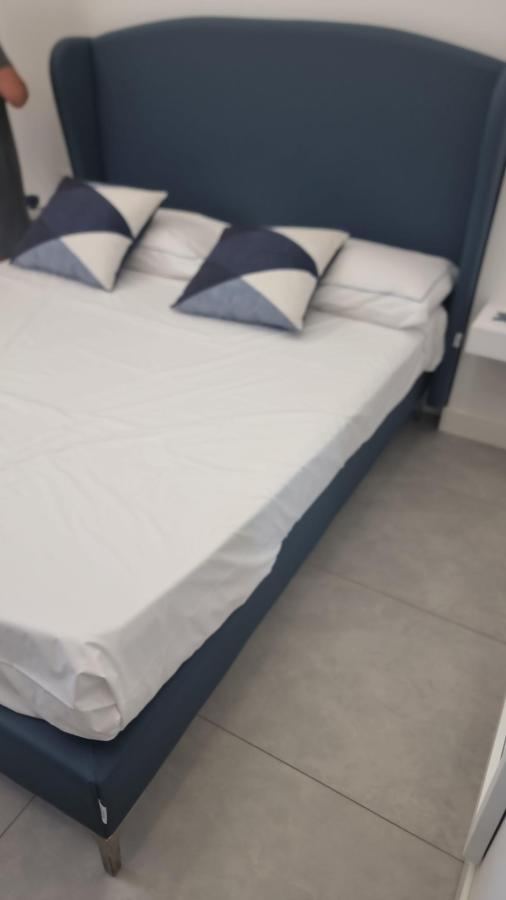 Letto o letti in una camera di Kairos Tropea luxury rooms & pool