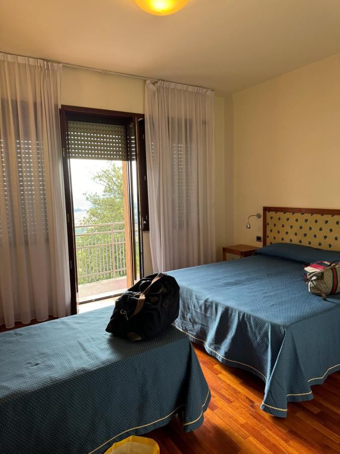 Letto o letti in una camera di Hotel Il Castellaccio