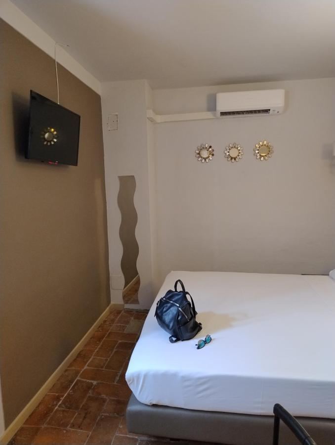 Letto o letti in una camera di Casa Grimaldi Hotel & Restaurant tre stelle S
