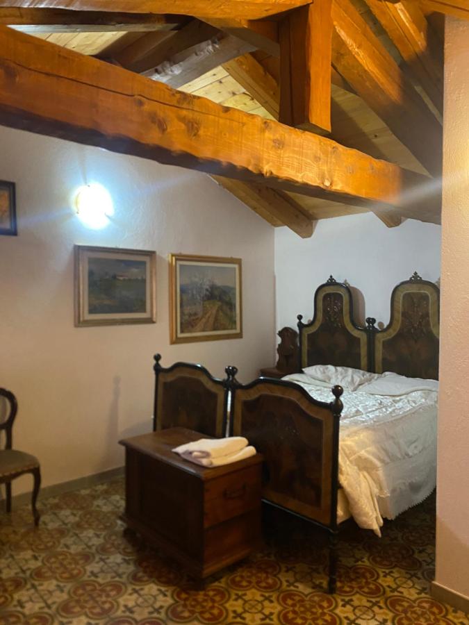 Letto o letti in una camera di La Corte Di Gerardo