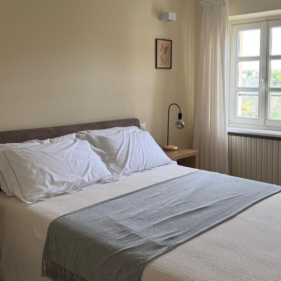 Letto o letti in una camera di Cascina Fontanavì