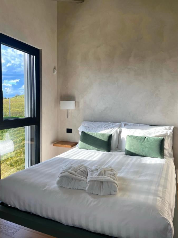 Letto o letti in una camera di VINEHO