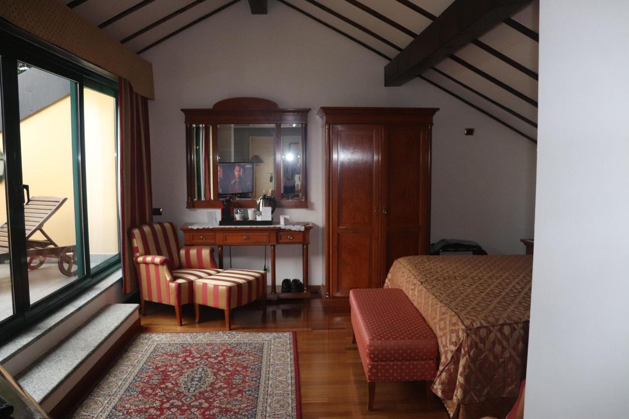 Letto o letti in una camera di Relais Casali della Cisterna